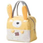 Lonchera térmica amarilla con diseño de conejo, asas reforzadas, ideal para mantener alimentos fríos o calientes.