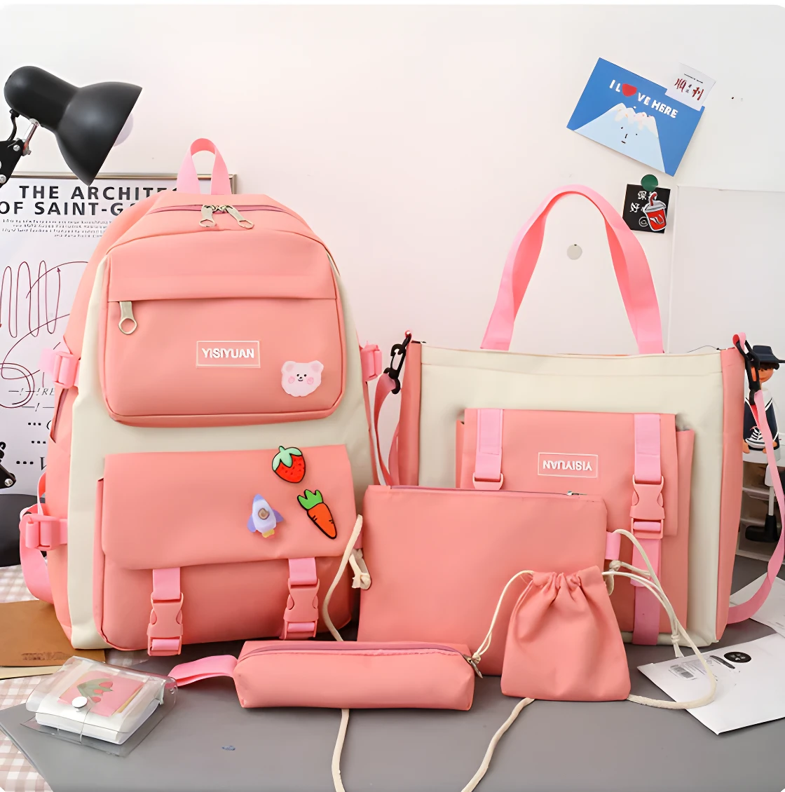 Maleta bolso 5 en 1 color rosa y crema para dama. Incluye varios compartimentos y diseños.