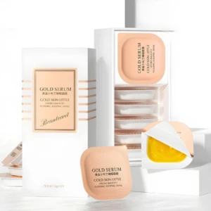 Set de mascarillas nocturnas Gold Serum en empaque y envase individual, textura tipo pudín dorada.