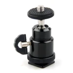 Mini rótula fotográfica negra con bola ajustable, tornillo 1/4” y base tipo zapata fría para accesorios.