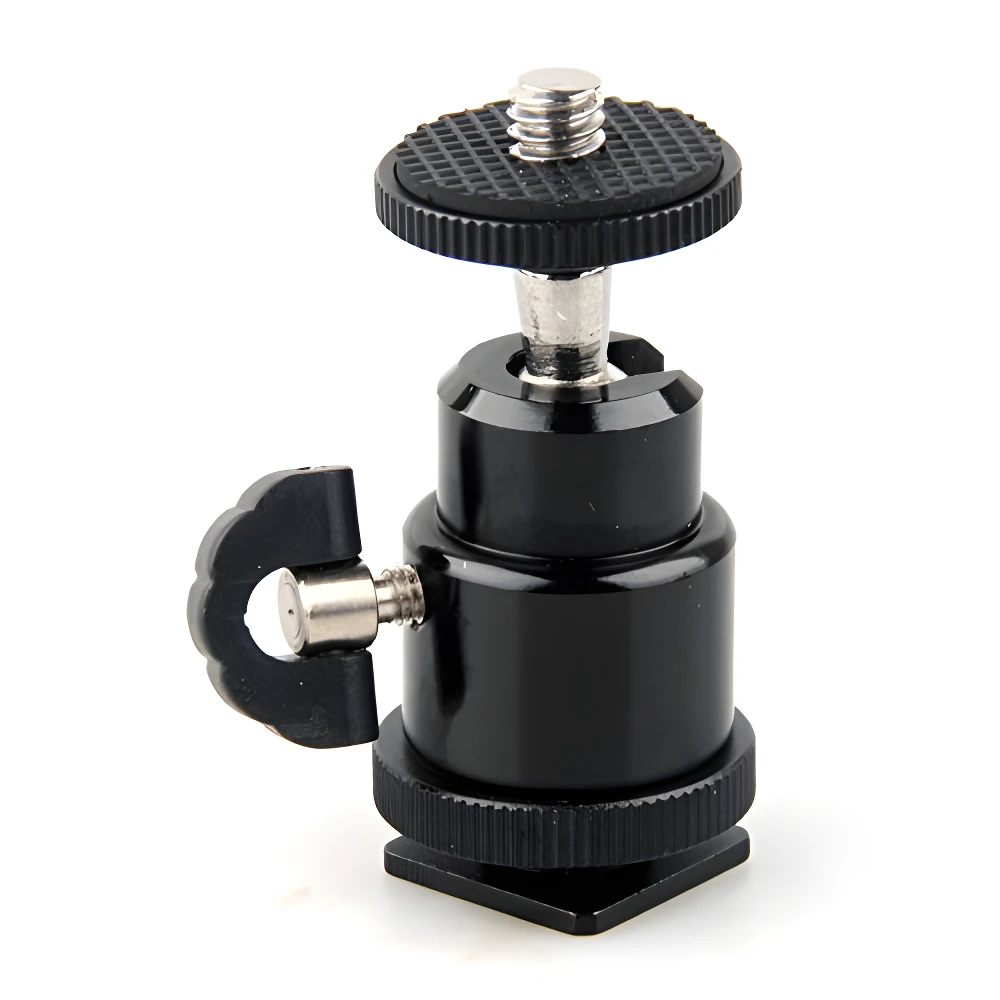 Mini rótula fotográfica negra con bola ajustable, tornillo 1/4” y base tipo zapata fría para accesorios.