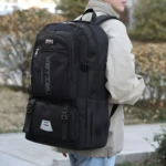 Morral mochilero negro grande con logo "SPORTS" y texto "XPT ZL AX FASHION". Ideal para viajes.