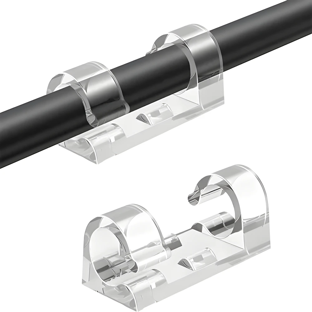 Dos clips organizadores de cables transparentes adhesivos VHB, uno sujetando un cable negro.