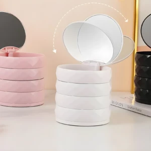 Organizador de joyas giratorio blanco con espejo abatible, ideal para tocador.