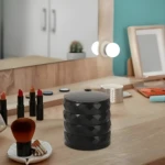 Organizador giratorio negro de 4 niveles para joyas, con textura facetada, ideal para tocador.