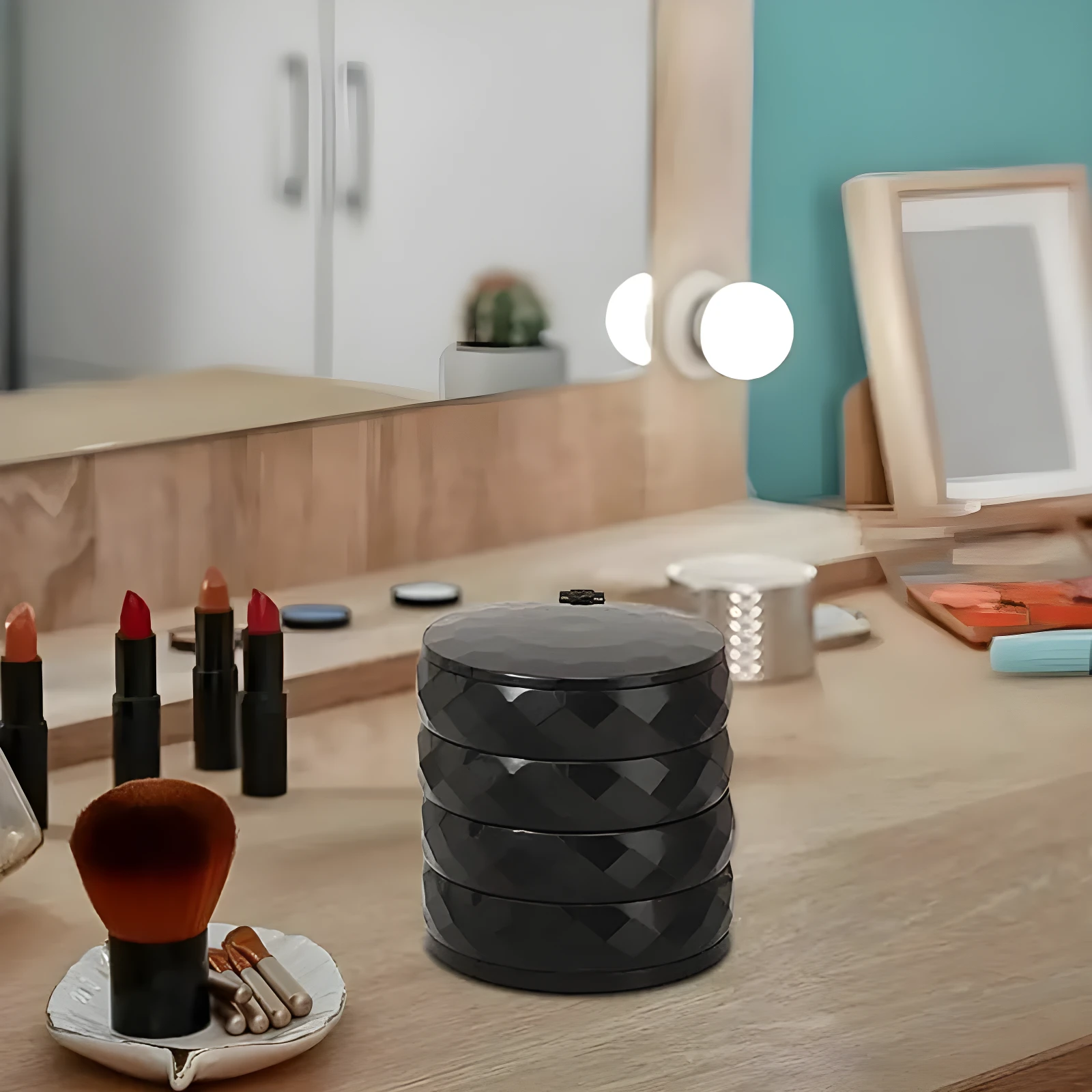 Organizador giratorio negro de 4 niveles para joyas, con textura facetada, ideal para tocador.