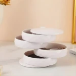 Organizador de joyas blanco giratorio de 4 niveles con tapa y espejo, ideal para accesorios.