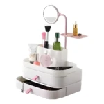 Organizador de maquillaje blanco con espejo LED giratorio, compartimentos para cosméticos y cajones desplegables.
