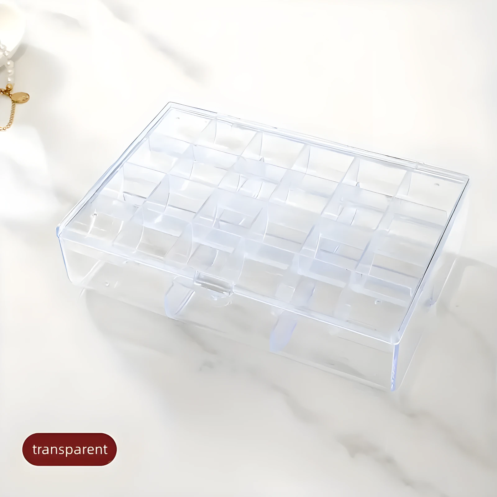 Joyero organizador apilable transparente con 24 compartimentos para accesorios, ideal para cosméticos o bisutería.