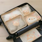 Set de 7 organizadores de viaje para niños con diseño de animalito, ideales para ropa y juguetes en maletas.