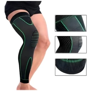 Manga de compresión larga negra con detalles verdes, cubre muslo y pantorrilla, mostrando texturas en rodilla y tobillo.