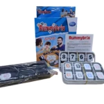 Caja del juego Rummikub con fichas, atriles y manual. Ideal para viajes.