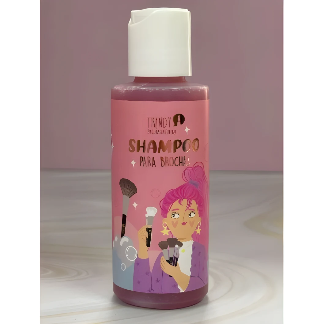 Shampoo limpiador Trendy para brochas en envase rosa con tapa blanca, mostrando una caricatura de mujer con brochas de maquillaje.