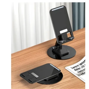 Set x4 soportes plegables negros para celular, ajustables en ángulo, sobre escritorio de madera.