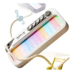Teclado pequeño de juguete "Rainbow Piano" blanco con teclas luminosas de colores y botones de efectos, atado con cuerda.