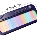 Teclado electrónico infantil púrpura con teclas coloridas numeradas del 1 al 7 y botones de función, dimensiones 17.1cm x 7.8cm.