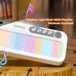 Teclado electrónico blanco con panel de luces arcoíris. Controles de función e interruptor de encendido visibles.