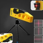 Nivel láser SHINTY amarillo y negro con trípode, proyecta líneas rojas para proyectos de alineación.