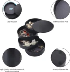 Mini organizador giratorio negro de 4 niveles para joyas, con almohadilla protectora de fieltro y base antideslizante.