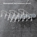 Tendedero plegable gris con 20 clips para ropa, resistente al agua, ideal para baños.