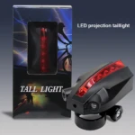 Luz trasera de bicicleta LED roja con proyector de líneas láser y empaque.