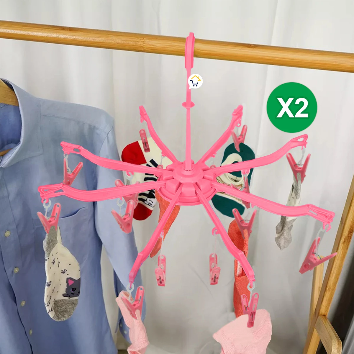 Gancho araña rosa para secar ropa con 16 pinzas. Ideal para calcetines. Se aprecian dos unidades del producto.