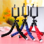 Trípodes flexibles para celular con patas de espuma negra, azul y roja.