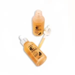 Dos frascos de serum Vitamina C 30% ámbar, uno con gotero.