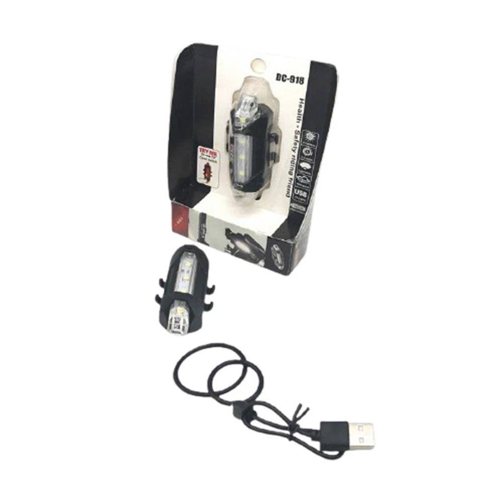 Luz delantera de bicicleta recargable impermeable DC-918 en empaque, y otra luz suelta con cable USB.
