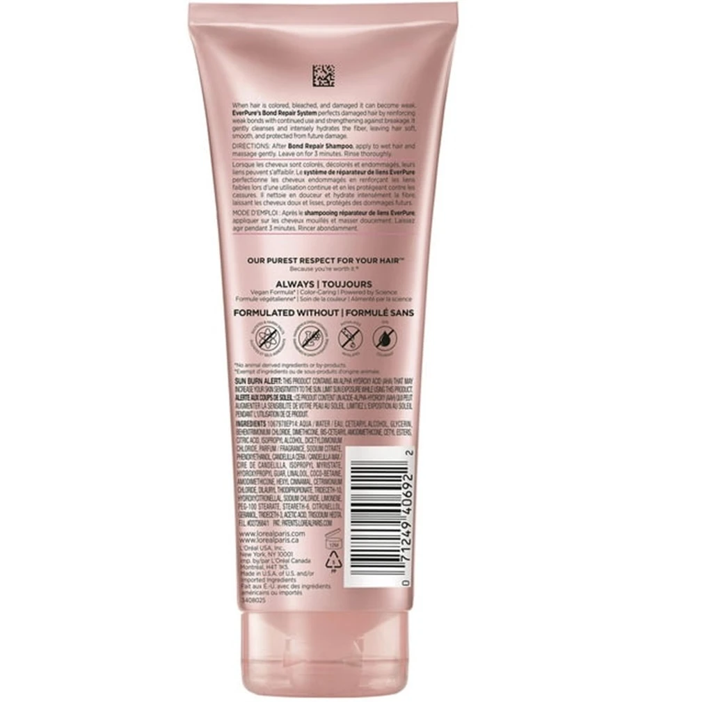 Loreal Acondicionador Reparador Bond Repair para cabello dañado. Texto en envase rosado.