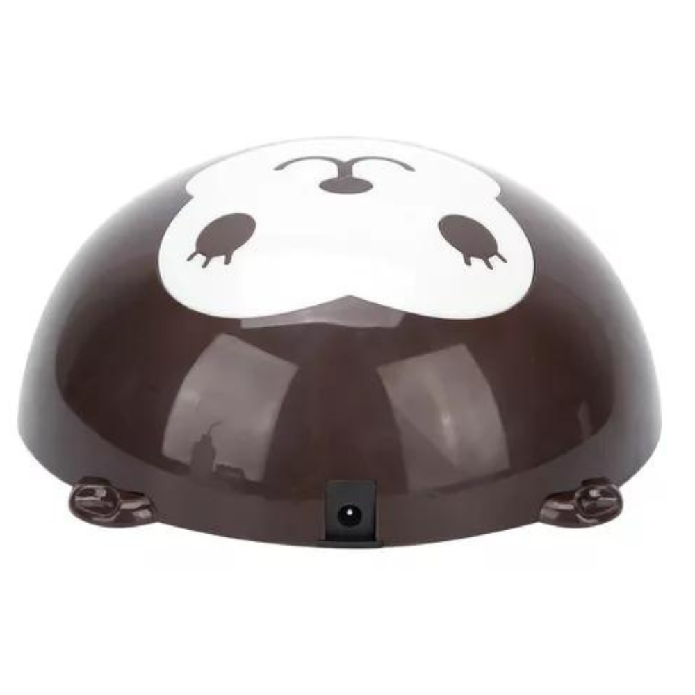 Lámpara UV LED para uñas en color café y diseño de mono, fabricada en ABS, vista desde el puerto de carga posterior con acabado brillante.