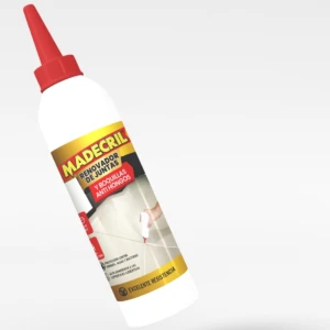 Botella de renovador de juntas y boquillas anti hongos MADEcrIL, con aplicador rojo, en uso sobre cerámica.