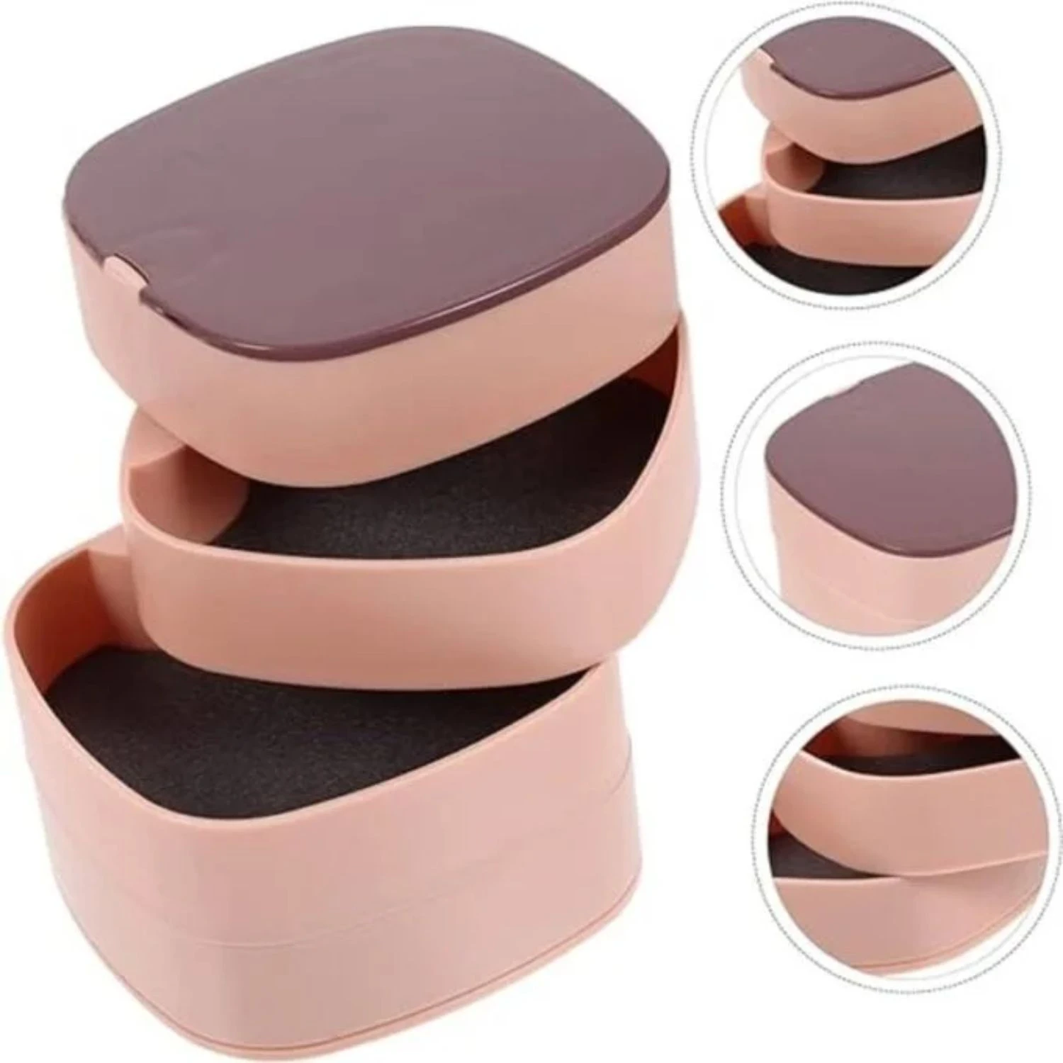 Joyero giratorio rosa de 3 niveles con tapa, forro oscuro y forma de corazón.