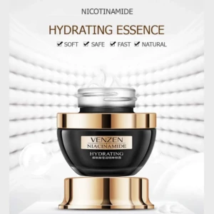 Tarro de crema hidratante Venzen con niacinamida, envase negro de tapa dorada con textura cremosa expuesta sobre fondo blanco difuminado y elegante.