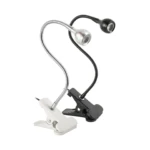 Dos lámparas UV LED para uñas con clip de sujeción: una plateada con brazo flexible cromado y otra negra con acabado mate, ajustables para secado.