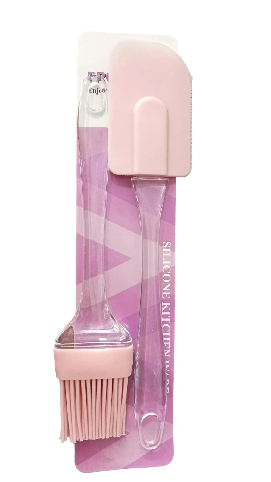 Kit de brocha y espátula de cocina color rosa pastel, fabricados en silicona con mangos de acrílico transparente, presentados sobre cartón informativo.