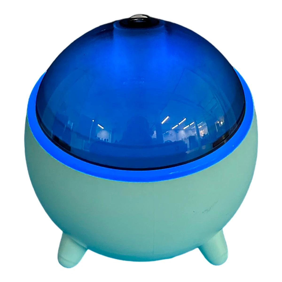 Humidificador Q803 color menta con luz LED azul, forma esférica y tres patas.
