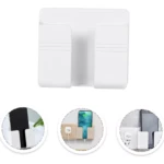 Soporte de pared blanco para celular, ideal para cargar, con compartimento lateral para adaptador.