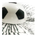 Calcomanía 3D de cristal con diseño de pelota de fútbol en blanco y negro sobre fondo abstracto.