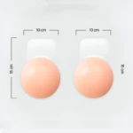 Par de cubre pezones levanta senos de silicona color piel, con diseño adhesivo y dimensiones de 10 cm de ancho por 15 cm de alto cada uno.
