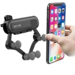 Soporte de celular negro para auto con clips grises ajustables, ideal para rejillas de ventilación.