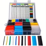 Kit de tubos termorretráctiles en caja organizadora con diversos colores: negro, rojo, azul, amarillo, verde y transparente.