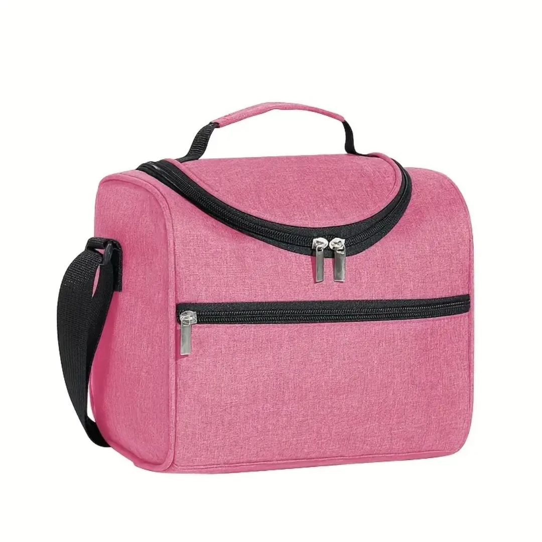 Lonchera térmica rosa con dos compartimentos con cremallera, asa y correa ajustable.