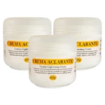 Combo de tres tarros de Crema Aclarante Lotux de 60g, envases blancos con tapa redonda, diseñados para reducir manchas e hiperpigmentación de la piel.