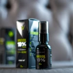 Set x2 Minoxidil 10% Crexion, frasco spray negro sobre fondo texturizado gris.