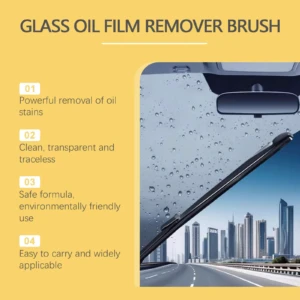 Cepillo removedor de película de aceite en parabrisas con gotas de agua y vista urbana.
