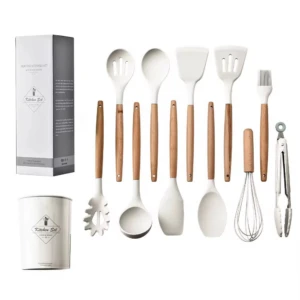 Set de 12 utensilios de cocina en silicona blanca con mangos de madera, incluye espátulas, cucharones, batidor, pinzas, envase organizador y su caja.