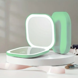 Mini espejo compacto portátil verde menta con luz led, ideal para maquillaje.