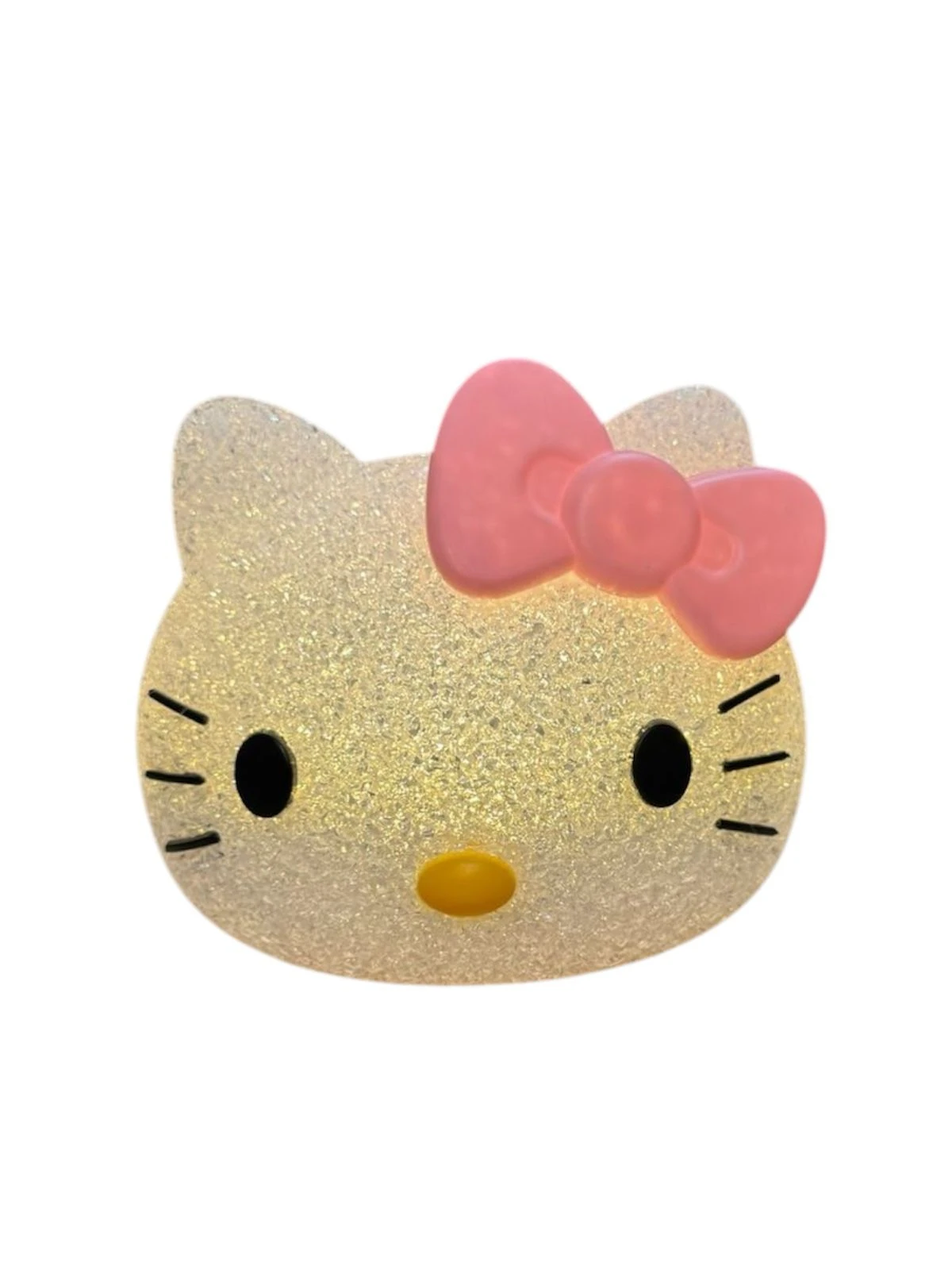 Lampara de mesa Kawaii con forma de Hello Kitty en material traslucido con acabado brillante, presenta cara clara, bigotes negros y lazo rosa superior.