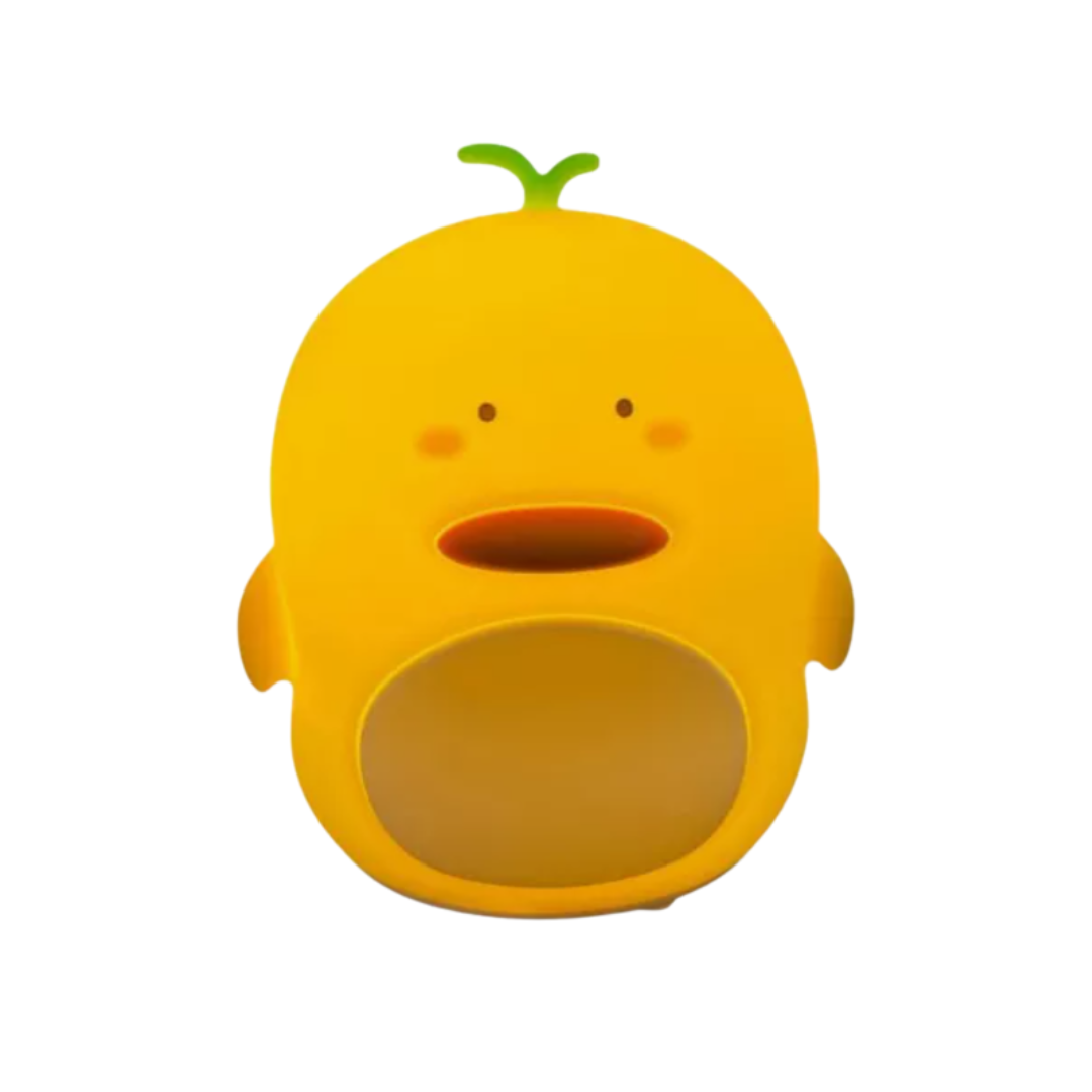 Lámpara LED de pollo en silicona amarilla, diseño ergonómico de textura suave, con luz cálida ideal para ambiente nocturno, recargable mediante USB.